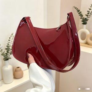 Geometric shoulder design, embossed pattern, underarm zipper, stylish tote bag