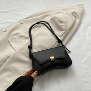 Minimalist nylon handbag for women, featuring a crossbody strap and underarm handles.